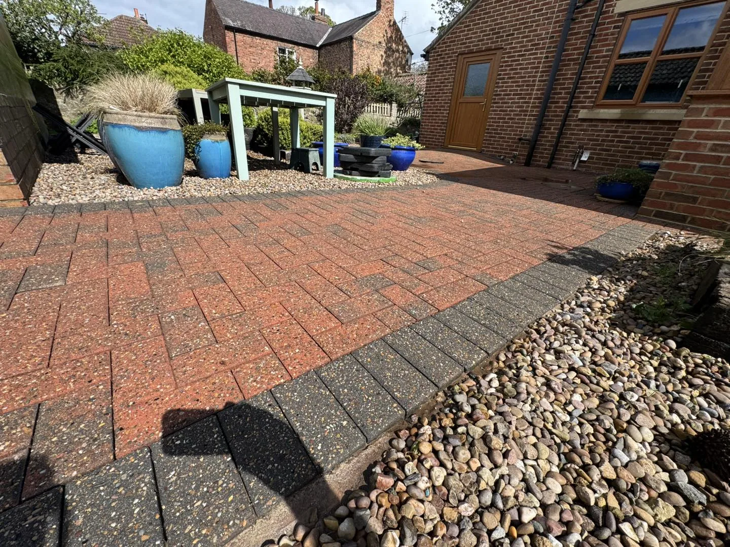 The same Thirsk driveway after cleaning by Hopkins, the block paving restored to its original red and charcoal colour