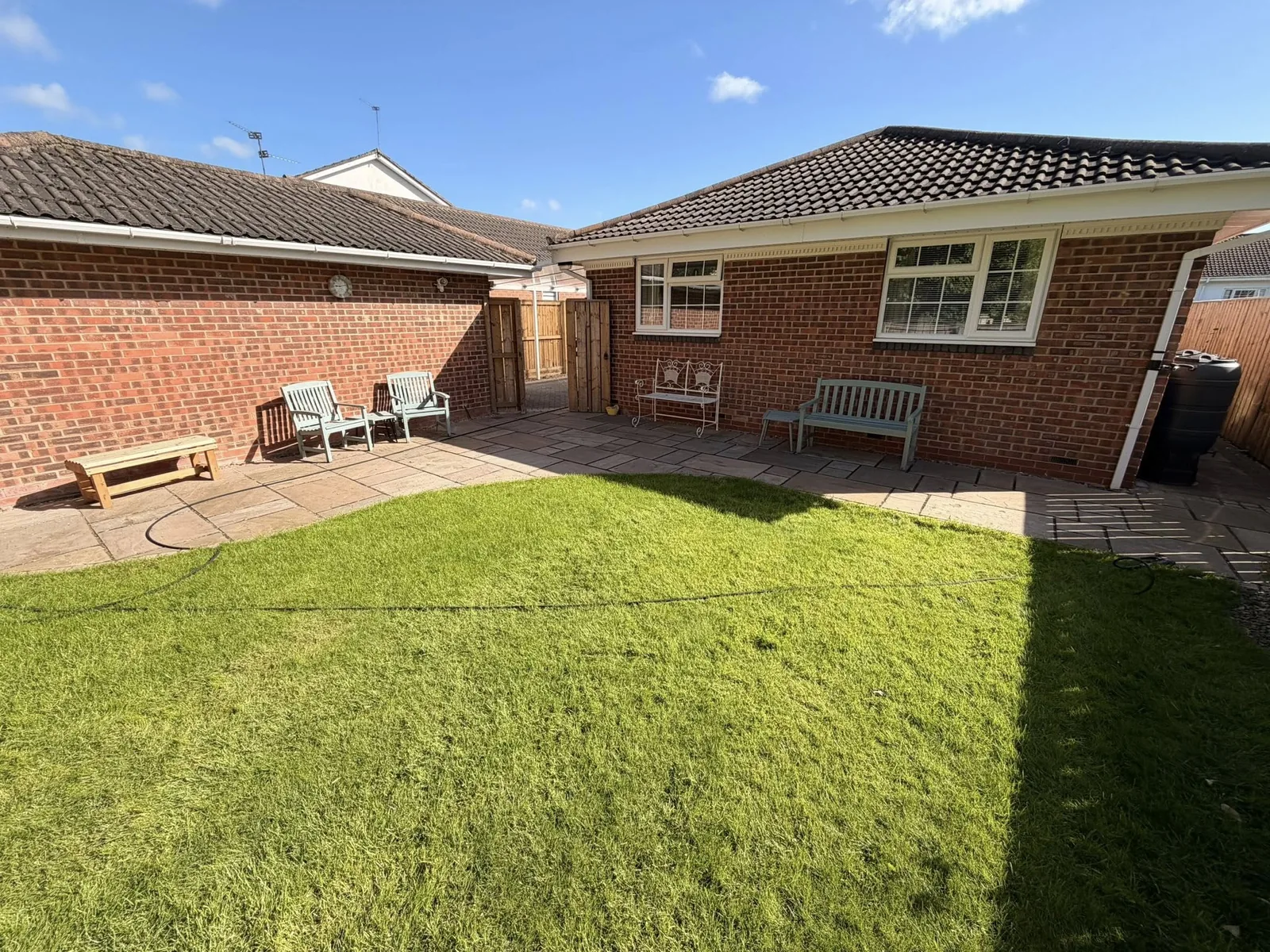 A cleaned garden lawn and patio area in Thirsk